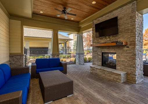 the preserve at ballantyne commons covered patio with fireplace and seating