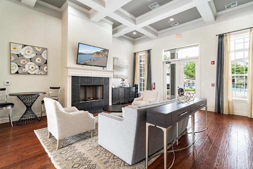 a living room with a couch and a table and a fireplace