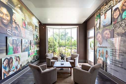 A wall of posters with the word "smile" on them.