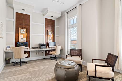 A modern office with a wooden panelled wall and a large window.