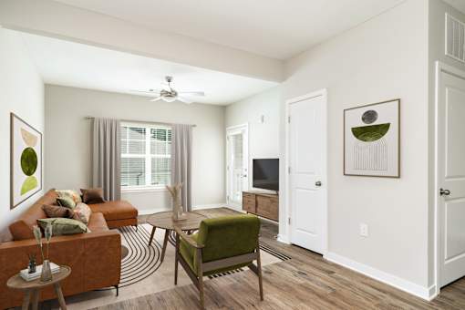 A living room with a brown couch, a green chair, and a brown table.