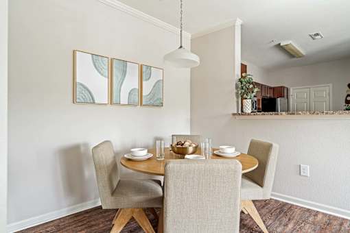 A dining room with a table set for two.