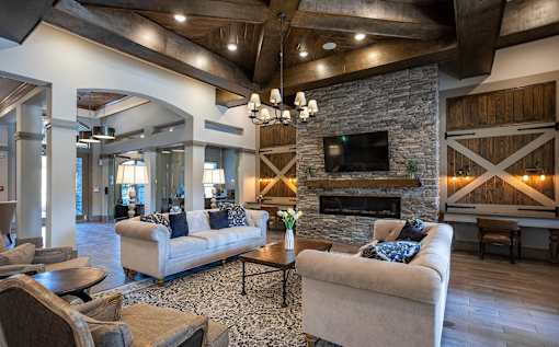a living room with couches and a fireplace