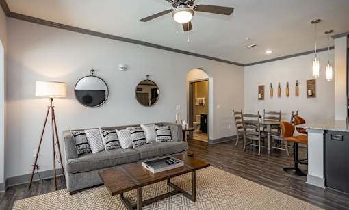 a living room and dining room with a couch and a table