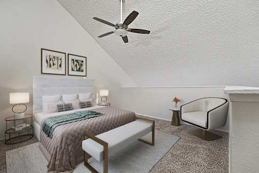 A bedroom with a bed, chair, and a ceiling fan.