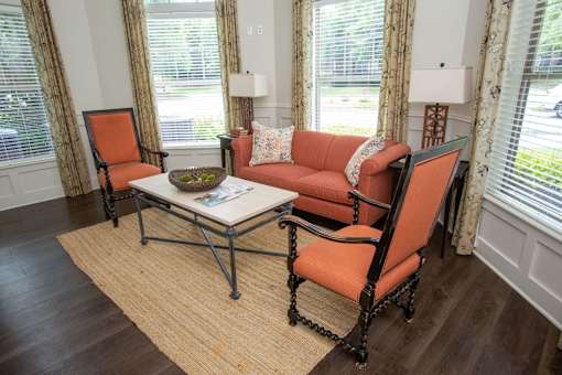 A living room with a sofa, chair, and coffee table.