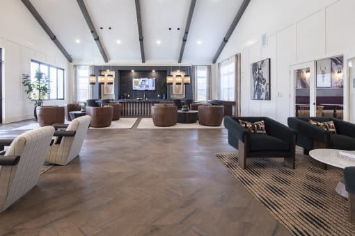 the lobby of a hotel with couches and chairs