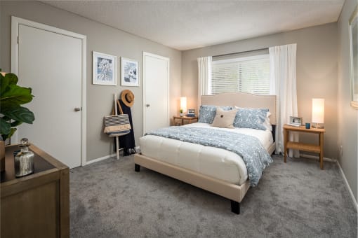 a bedroom with a bed and two nightstands  at Waterview at Rocky Point, Tampa