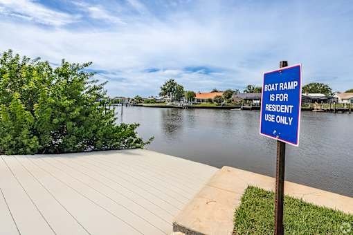 A sign on a boat ramp states that it is for resident use only.