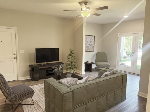 a living room with a couch and a tv