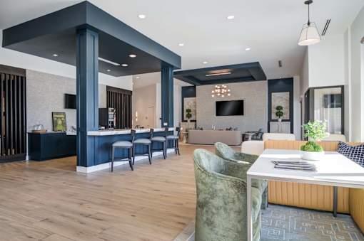 A modern dining area with a table set for two.