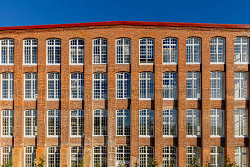 A red brick building with many windows.