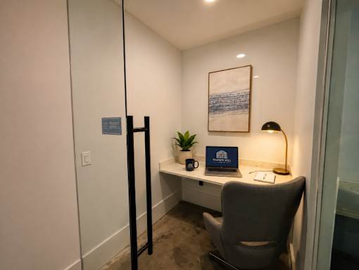 A room with a desk and a chair.