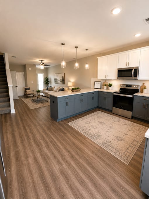 A kitchen with a stove top oven and a refrigerator.