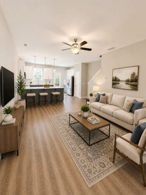 A living room with a television, a couch, and a coffee table.