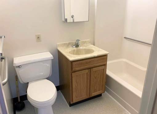 McKenzie House Bathroom with full bathtub and safety rails