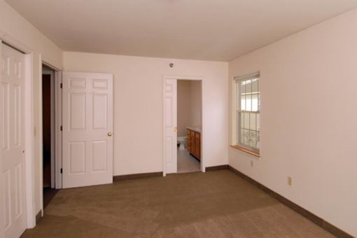 Interior of master bedroom a bathroom