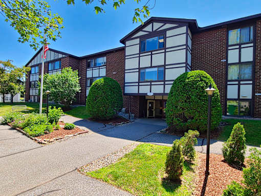 Exterior of the tudor style Country Park apartment building