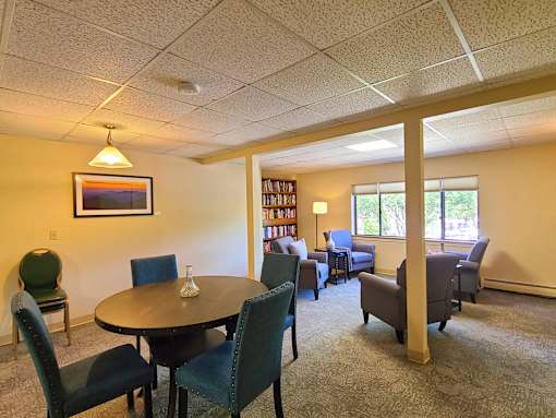 Country Park second floor lounge with seating and a bookcase