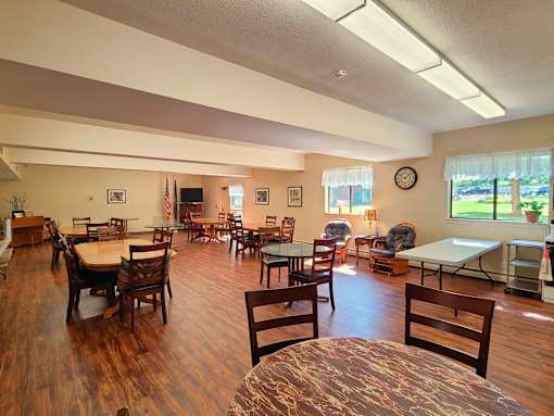 Country Park community room featuring tables and comfy chairs