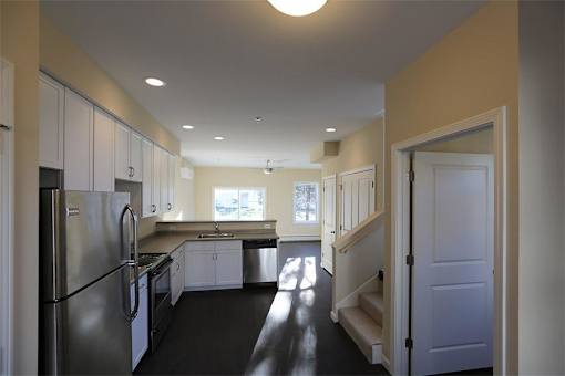 Rye kitchen with stainless steal refrigerator, dishwasher and stove