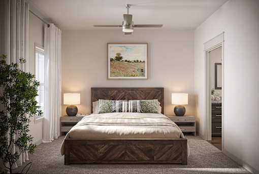 a bedroom with a bed and a ceiling fan