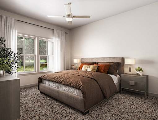 a bedroom with a bed and a ceiling fan