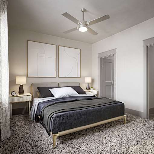 a bedroom with a bed and a ceiling fan