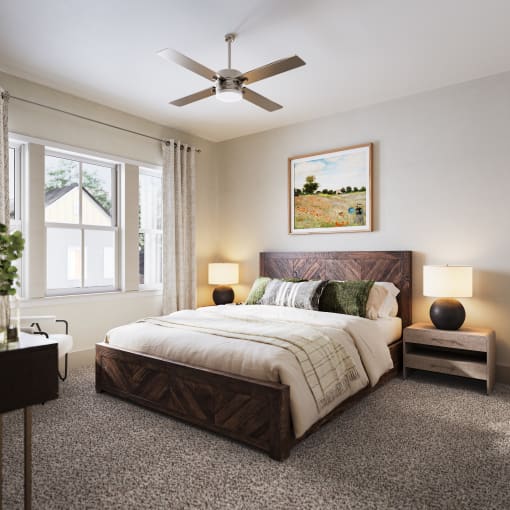 a bedroom with a bed and a ceiling fan