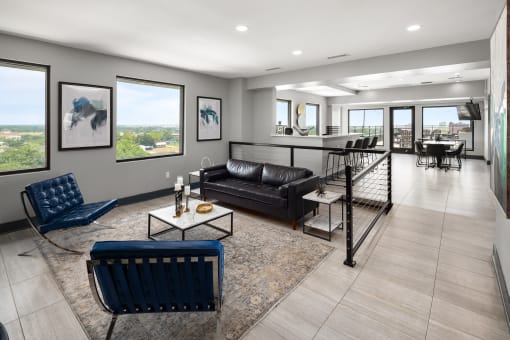 a living room filled with furniture and a large window