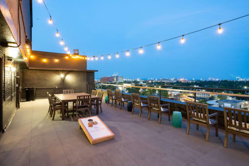 a roof top restaurant with a view of the city