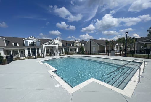 the preserve at ballantyne commons pool with apartment buildings in the background