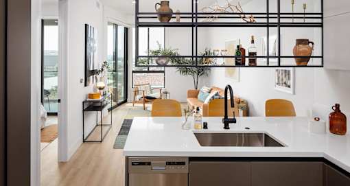 Hanging shelves make for a unique space divider in our one bedrooms