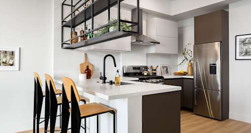 Hanging shelves make for a unique space divider in our one bedrooms