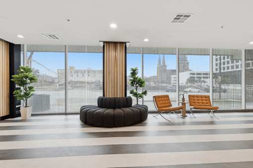 A modern waiting area with a view of the city.