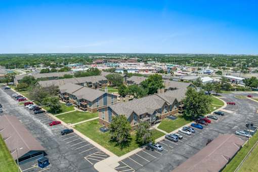 an aerial view of a neighborhood of houses in a parking lot