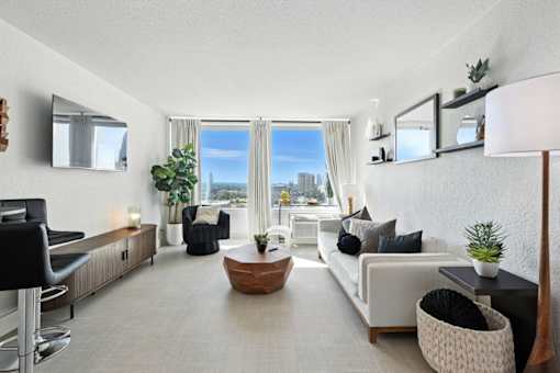 A modern living room with a view of the city.