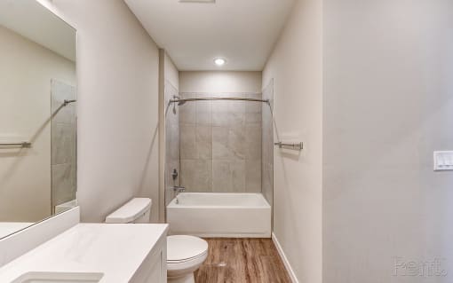 a bathroom with a shower and a toilet and a sink at Imperial Crossing Luxury Apartment Homes, Florida