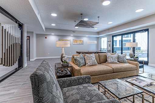 A living room with a couch, armchair, and coffee table.at Tiffany Flats, Ohio, 43231