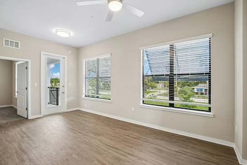 A room with a window and a door.