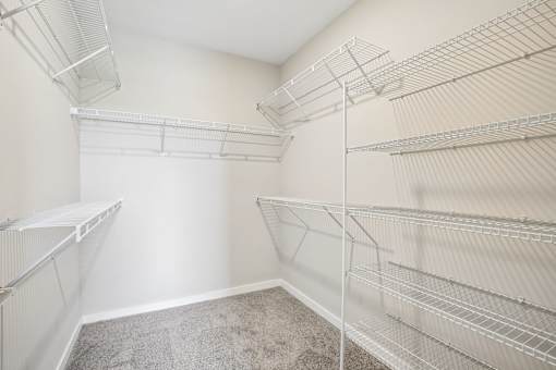 Empty white shelving unit in a room.