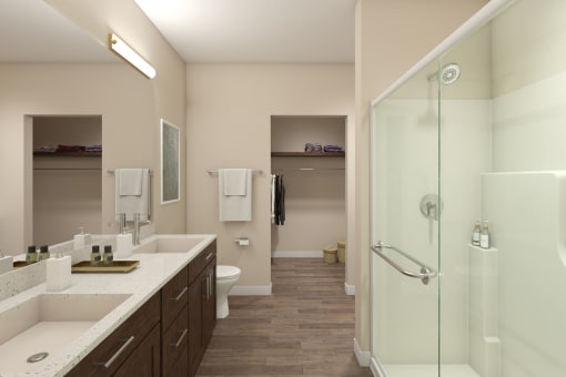 a bathroom with two sinks and a shower and a toilet at Tiffany Flats, Columbus, Ohio
