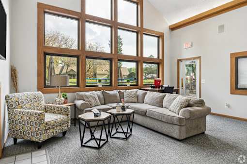 The clubhouse and leasing office at The Woods at McNeil Farms welcomes you! Enjoy amenities like a shared space, pool, and on-site laundry facility.