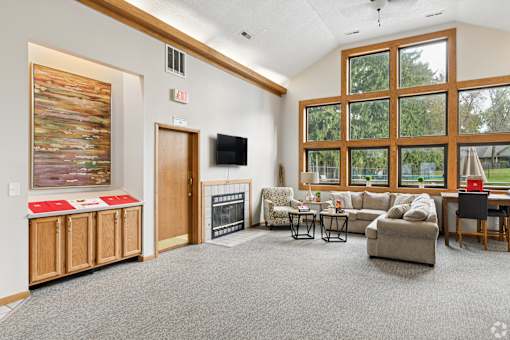 The clubhouse and leasing office at The Woods at McNeil Farms welcomes you! Enjoy amenities like a shared space, pool, and on-site laundry facility.