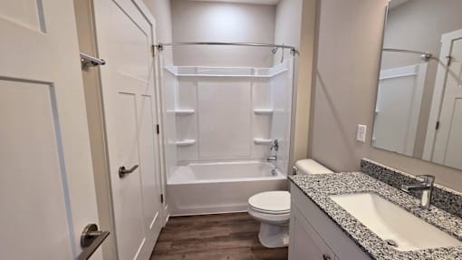 A bathroom of an available apartment at Greenwood Commons Apartments in Delaware, OH.