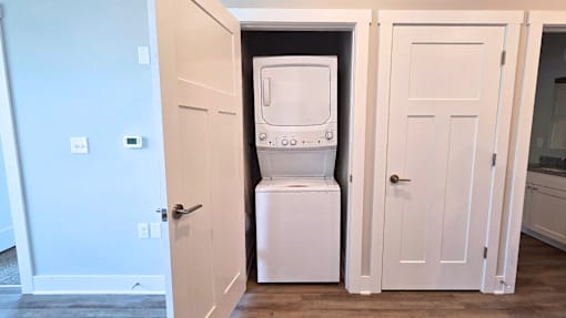 In-unit washer and dryer in the living area of an apartment at Greenwood Commons Apartments in Delaware, OH.