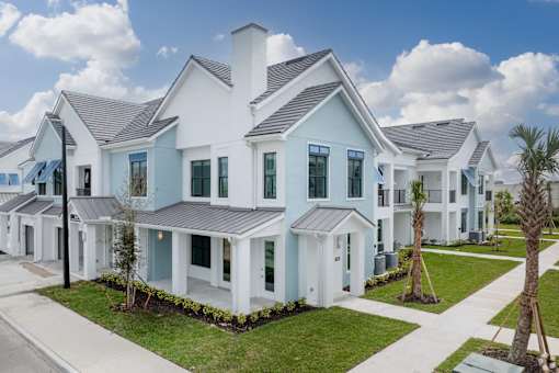 A row of houses with a blue sky in the background.at Imperial Crossing Luxury Apartment Homes, Florida
