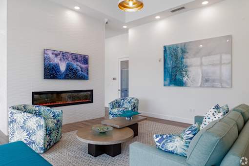 Living Area With Fireplace And TV at Imperial Crossing Luxury Apartment Homes, Bonita Springs