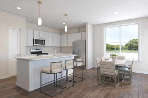 a kitchen with a large island and a table with chairs at Tiffany Flats, Ohio, 43231