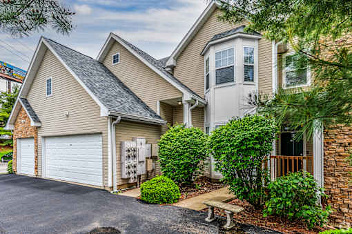 A house with a garage and a driveway.
